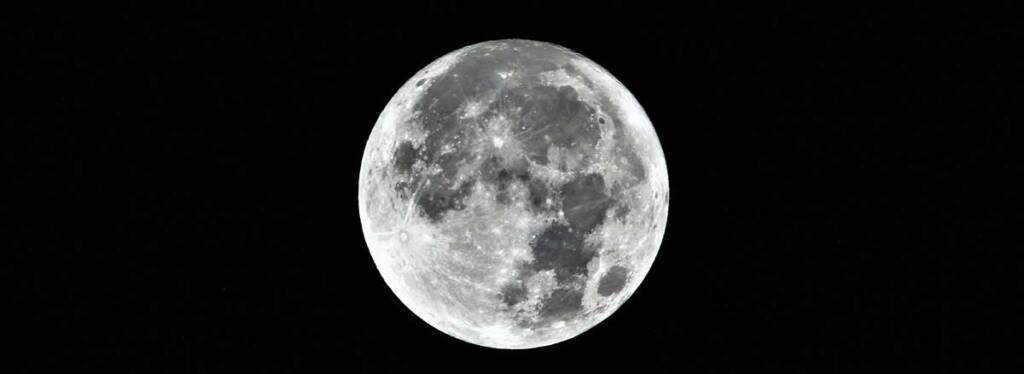 Full moon in clear night sky.