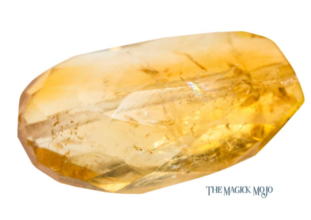 Polished citrine crystal with a bright yellow hue on a white background.