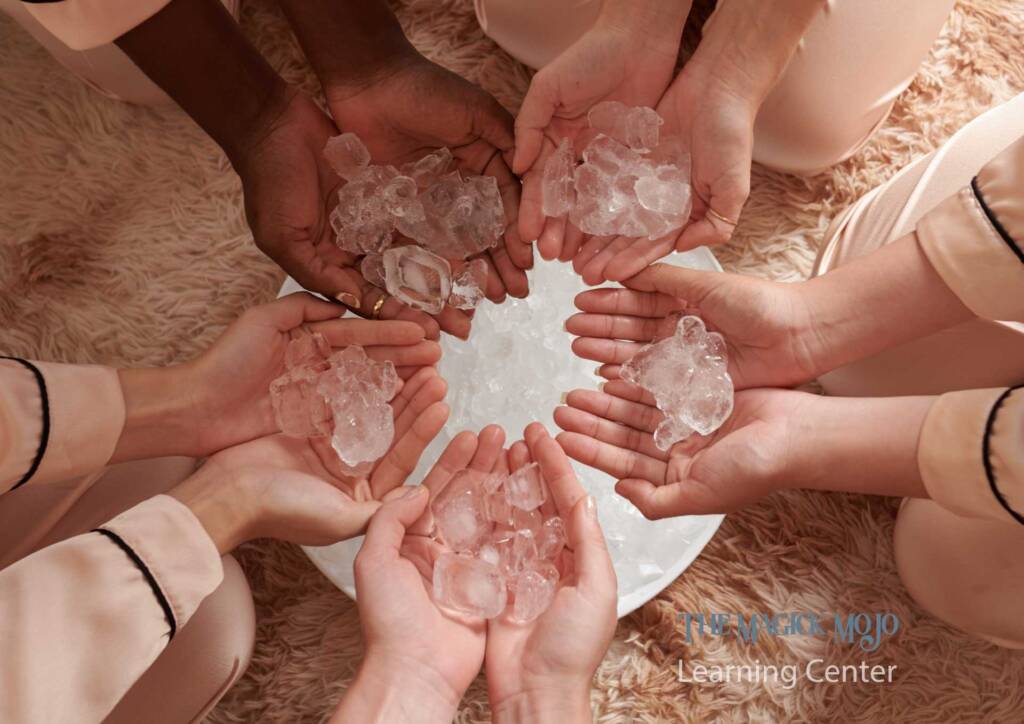 Women holding rose quartz crystals in a circle