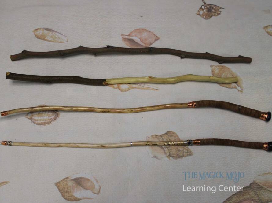 Progression of magic wand crafting, showing raw sticks at various stages of preparation to finished wands with decorative elements.